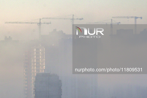 High-rise buildings are seen through the dense fog in Kyiv, Ukraine, on November 25, 2024. NO USE RUSSIA. NO USE BELARUS. 