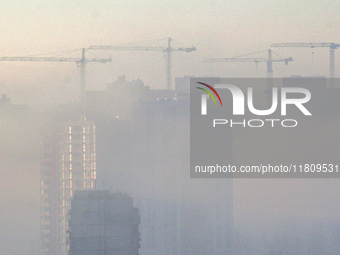 High-rise buildings are seen through the dense fog in Kyiv, Ukraine, on November 25, 2024. NO USE RUSSIA. NO USE BELARUS. (