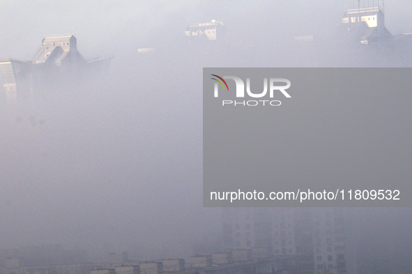 High-rise buildings are seen through the dense fog in Kyiv, Ukraine, on November 25, 2024. NO USE RUSSIA. NO USE BELARUS. 