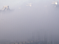 High-rise buildings are seen through the dense fog in Kyiv, Ukraine, on November 25, 2024. NO USE RUSSIA. NO USE BELARUS. (