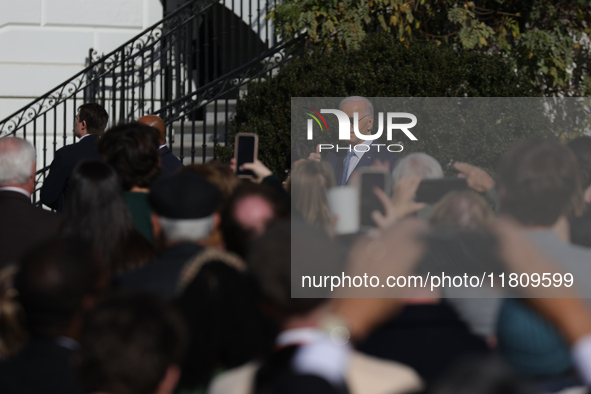 U.S. President Joe Biden greets guests at the 77th anniversary of the National Thanksgiving Turkey presentation on the South Lawn of the Whi...