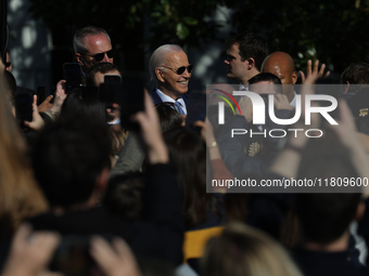 U.S. President Joe Biden greets guests at the 77th anniversary of the National Thanksgiving Turkey presentation on the South Lawn of the Whi...