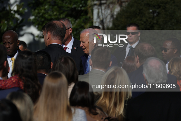 A bee lands on the face of U.S. President Joe Biden as he greets people during the 77th anniversary of the National Thanksgiving Turkey pres...