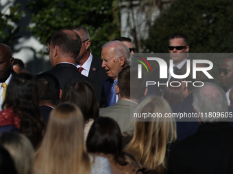 A bee lands on the face of U.S. President Joe Biden as he greets people during the 77th anniversary of the National Thanksgiving Turkey pres...