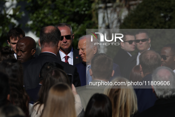 A bee lands on the face of U.S. President Joe Biden as he greets people during the 77th anniversary of the National Thanksgiving Turkey pres...