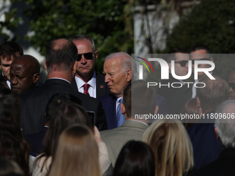 A bee lands on the face of U.S. President Joe Biden as he greets people during the 77th anniversary of the National Thanksgiving Turkey pres...