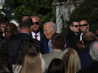 A bee lands on the face of U.S. President Joe Biden as he greets people during the 77th anniversary of the National Thanksgiving Turkey pres...