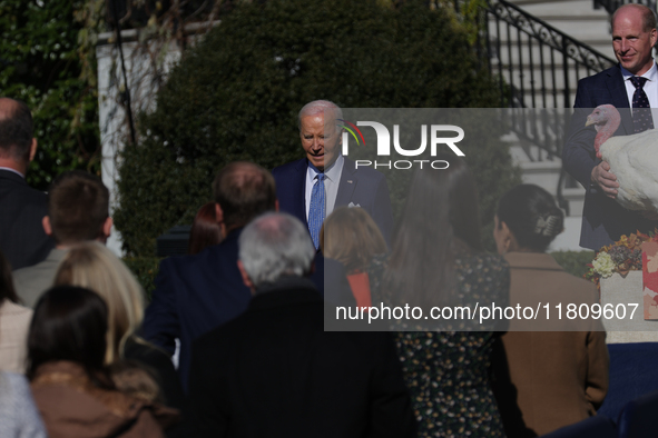 U.S. President Joe Biden greets guests at the 77th anniversary of the National Thanksgiving Turkey presentation on the South Lawn of the Whi...