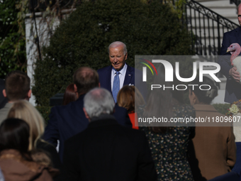 U.S. President Joe Biden greets guests at the 77th anniversary of the National Thanksgiving Turkey presentation on the South Lawn of the Whi...