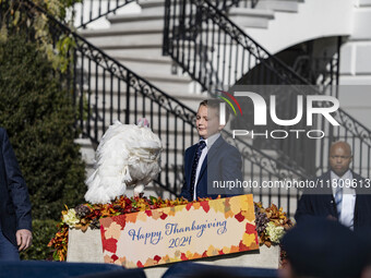 On November 25, 2024, in Washington, D.C., President Joe Biden pardons Peach and Blossom, two Minnesota turkeys, at an event on the South La...