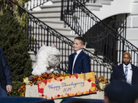 On November 25, 2024, in Washington, D.C., President Joe Biden pardons Peach and Blossom, two Minnesota turkeys, at an event on the South La...