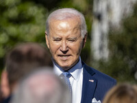 On November 25, 2024, in Washington, D.C., President Joe Biden pardons Peach and Blossom, two Minnesota turkeys, at an event on the South La...