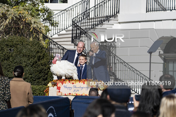 On November 25, 2024, in Washington, D.C., President Joe Biden pardons Peach and Blossom, two Minnesota turkeys, at an event on the South La...