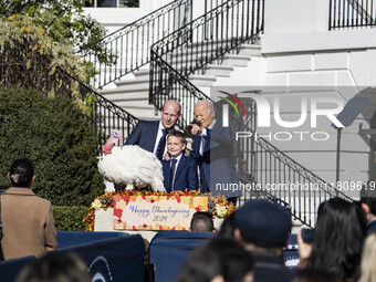 On November 25, 2024, in Washington, D.C., President Joe Biden pardons Peach and Blossom, two Minnesota turkeys, at an event on the South La...