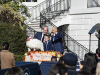 On November 25, 2024, in Washington, D.C., President Joe Biden pardons Peach and Blossom, two Minnesota turkeys, at an event on the South La...