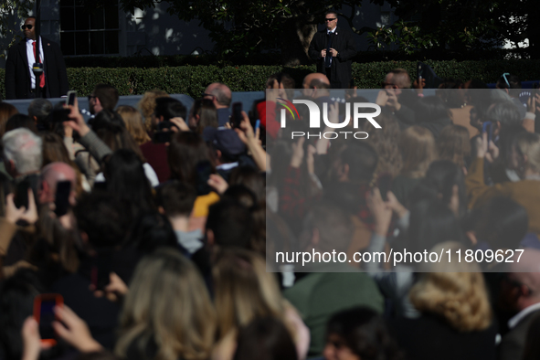 U.S. Secret Service agents watch a crowd at the 77th anniversary of the National Thanksgiving Turkey presentation, pardoning two turkeys, 'P...