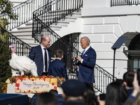 On November 25, 2024, in Washington, D.C., President Joe Biden pardons Peach and Blossom, two Minnesota turkeys, at an event on the South La...