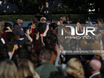 A U.S. Secret Service agent watches a crowd at the 77th anniversary of the National Thanksgiving Turkey presentation, pardoning two turkeys,...