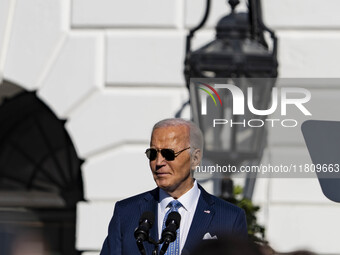 On November 25, 2024, in Washington, D.C., President Joe Biden pardons Peach and Blossom, two Minnesota turkeys, at an event on the South La...