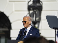 On November 25, 2024, in Washington, D.C., President Joe Biden pardons Peach and Blossom, two Minnesota turkeys, at an event on the South La...