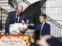 On November 25, 2024, in Washington, D.C., President Joe Biden pardons Peach and Blossom, two Minnesota turkeys, at an event on the South La...