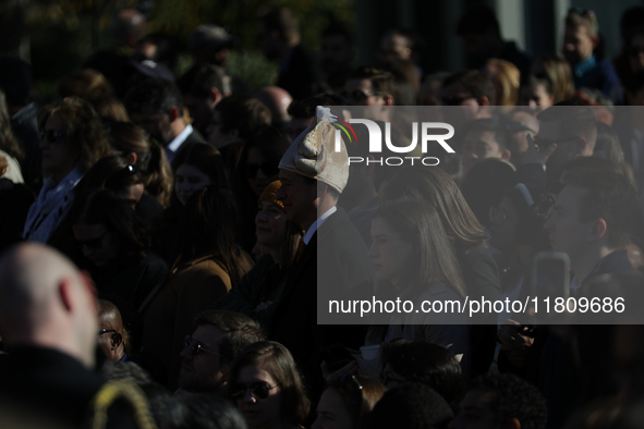 A person wears a hat resembling a turkey at the 77th anniversary of the National Thanksgiving Turkey presentation on the South Lawn of the W...