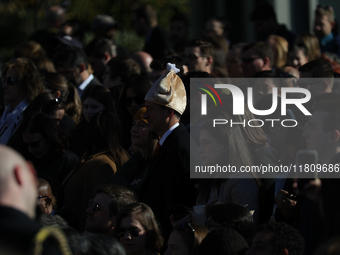 A person wears a hat resembling a turkey at the 77th anniversary of the National Thanksgiving Turkey presentation on the South Lawn of the W...