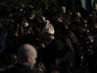 A person wears a hat resembling a turkey at the 77th anniversary of the National Thanksgiving Turkey presentation on the South Lawn of the W...