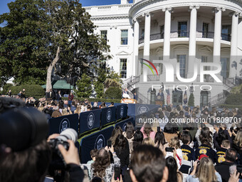 On November 25, 2024, in Washington, D.C., President Joe Biden pardons Peach and Blossom, two Minnesota turkeys, at an event on the South La...