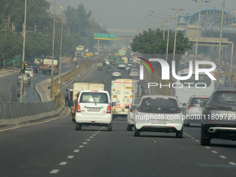 Vehicles travel on the roads during smoggy conditions in New Delhi, India, on November 24, 2024. (