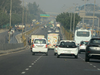 Vehicles travel on the roads during smoggy conditions in New Delhi, India, on November 24, 2024. (