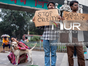 Some students of Dhaka University stage a protest against the action of killing dogs by poisoned food at Japan Garden City in Dhaka, Banglad...