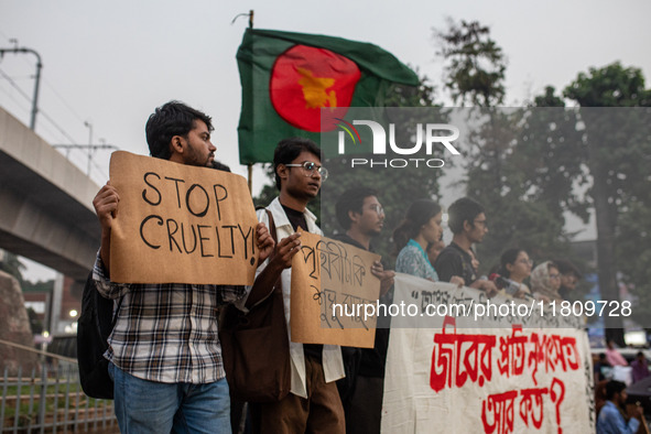 Some students of Dhaka University stage a protest against the action of killing dogs by poisoned food at Japan Garden City in Dhaka, Banglad...