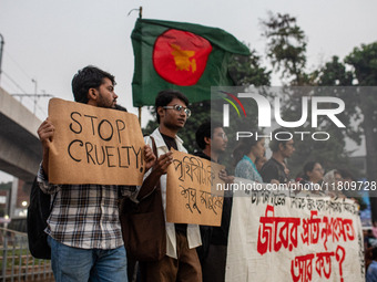 Some students of Dhaka University stage a protest against the action of killing dogs by poisoned food at Japan Garden City in Dhaka, Banglad...