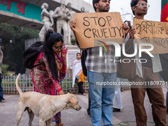 Some students of Dhaka University stage a protest against the action of killing dogs by poisoned food at Japan Garden City in Dhaka, Banglad...