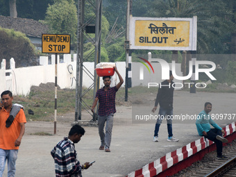 Indian people are seen at the railway station in Silout, Bihar, on November 24, 2024. (