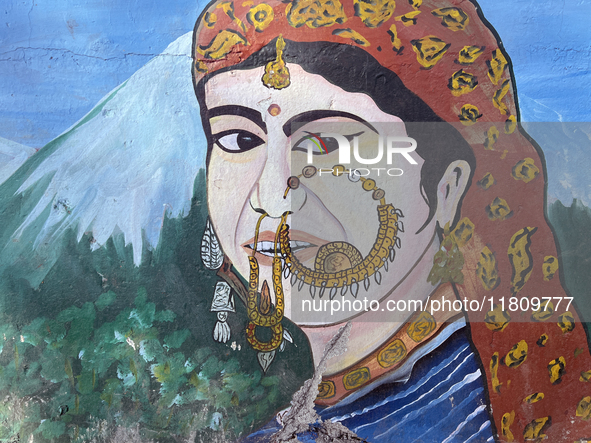 A mural of a traditional Kumaon village woman is along the Mall Road in Mussoorie, Uttarakhand, India, on April 18, 2024. 