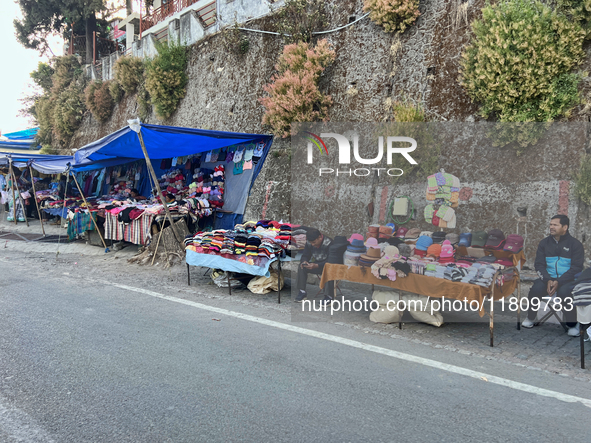 People sell clothing along the Mall Road in Mussoorie, Uttarakhand, India, on April 18, 2024. 