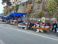 People sell clothing along the Mall Road in Mussoorie, Uttarakhand, India, on April 18, 2024. (