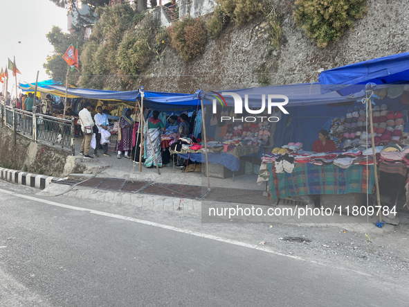 People sell clothing along the Mall Road in Mussoorie, Uttarakhand, India, on April 18, 2024. 