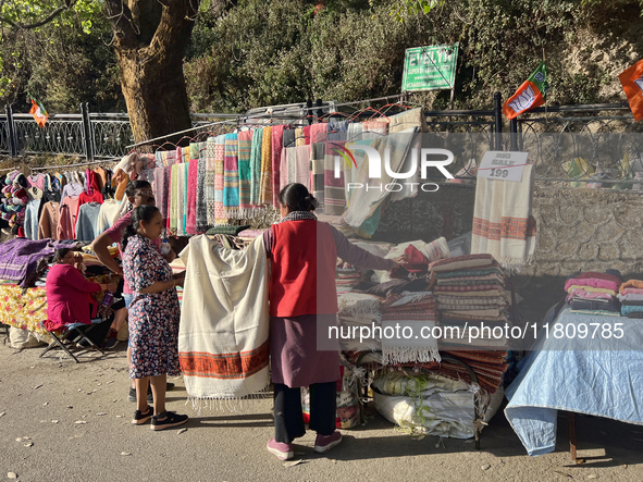 People sell clothing along the Mall Road in Mussoorie, Uttarakhand, India, on April 18, 2024. 