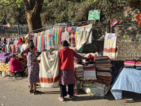 People sell clothing along the Mall Road in Mussoorie, Uttarakhand, India, on April 18, 2024. (