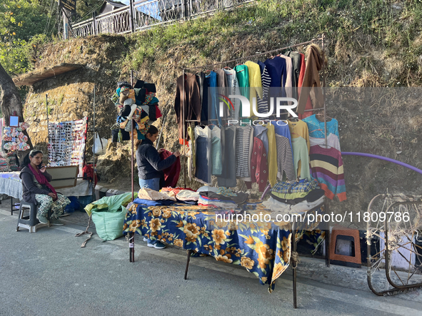 People sell clothing along the Mall Road in Mussoorie, Uttarakhand, India, on April 18, 2024. 