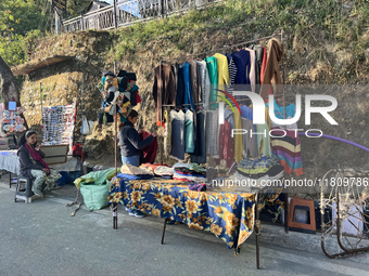 People sell clothing along the Mall Road in Mussoorie, Uttarakhand, India, on April 18, 2024. (