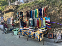 People sell clothing along the Mall Road in Mussoorie, Uttarakhand, India, on April 18, 2024. (