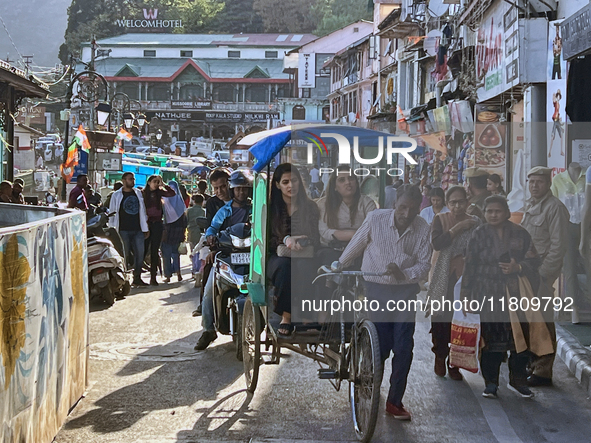 A crowd of people gathers along the Mall Road in Mussoorie, Uttarakhand, India, on April 18, 2024. 