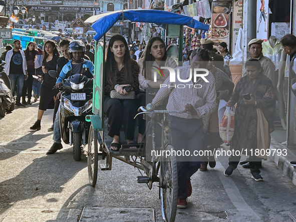 A crowd of people gathers along the Mall Road in Mussoorie, Uttarakhand, India, on April 18, 2024. 