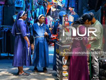 Nuns shop at the Bhutia Bazaar (Tibetan Market) in Nainital, Uttarakhand, India, on April 19, 2024. The Tibetan Market is located by Naini L...