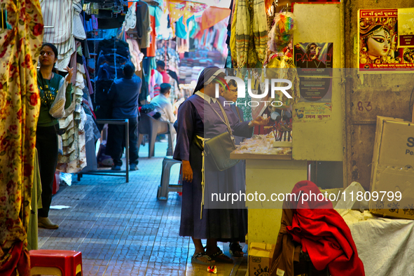 Nuns shop at the Bhutia Bazaar (Tibetan Market) in Nainital, Uttarakhand, India, on April 19, 2024. The Tibetan Market is located by Naini L...