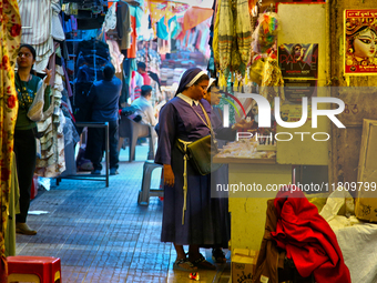 Nuns shop at the Bhutia Bazaar (Tibetan Market) in Nainital, Uttarakhand, India, on April 19, 2024. The Tibetan Market is located by Naini L...